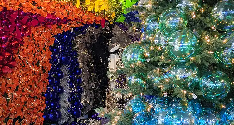 All shapes, sizes, and styles of high-end Christmas ornaments and floral stems are on display!